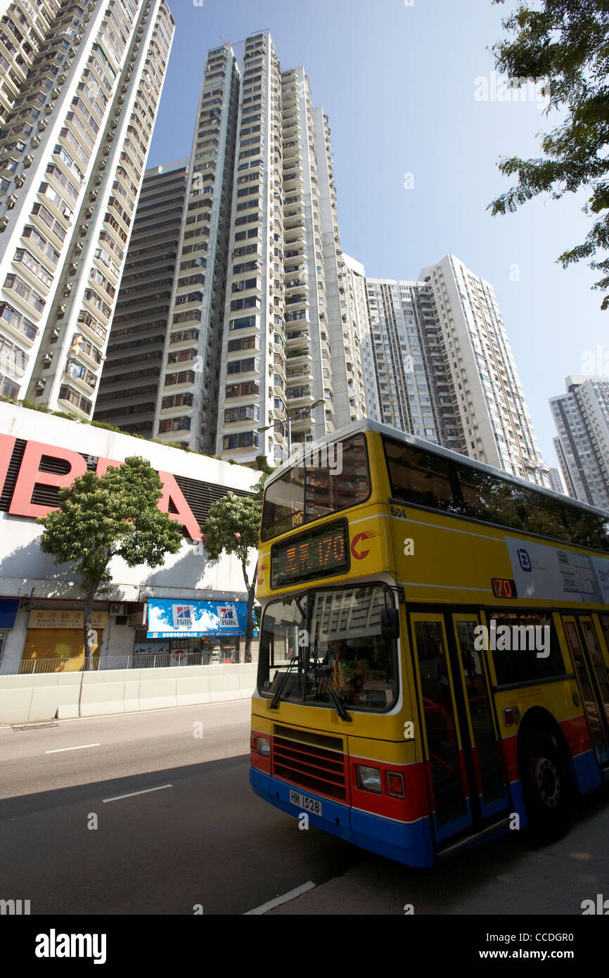 first bus company bus beneath skycraper apartment blocks aberdeen hong kong hksar china asia Stock Photo
