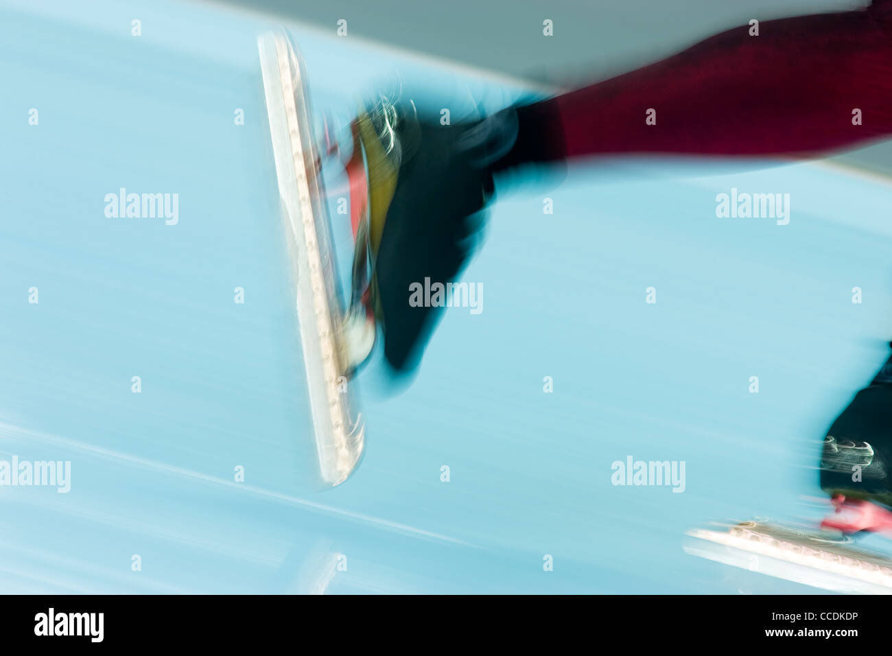 Detail of blurred action of speed skater's feet. Stock Photo