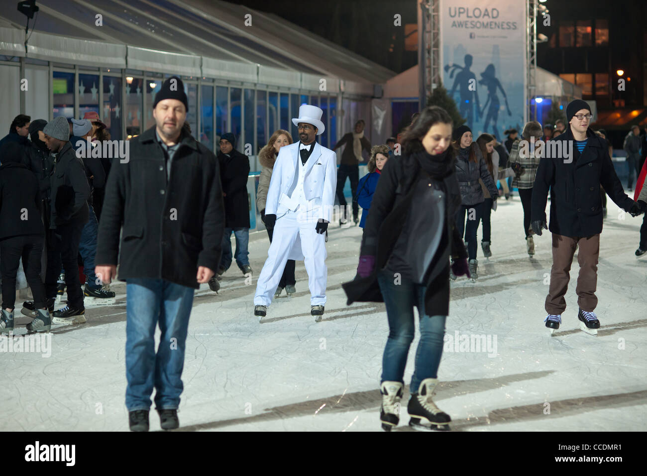 Skaters dressed in formal attire maneuver the packed Pond at Bryant