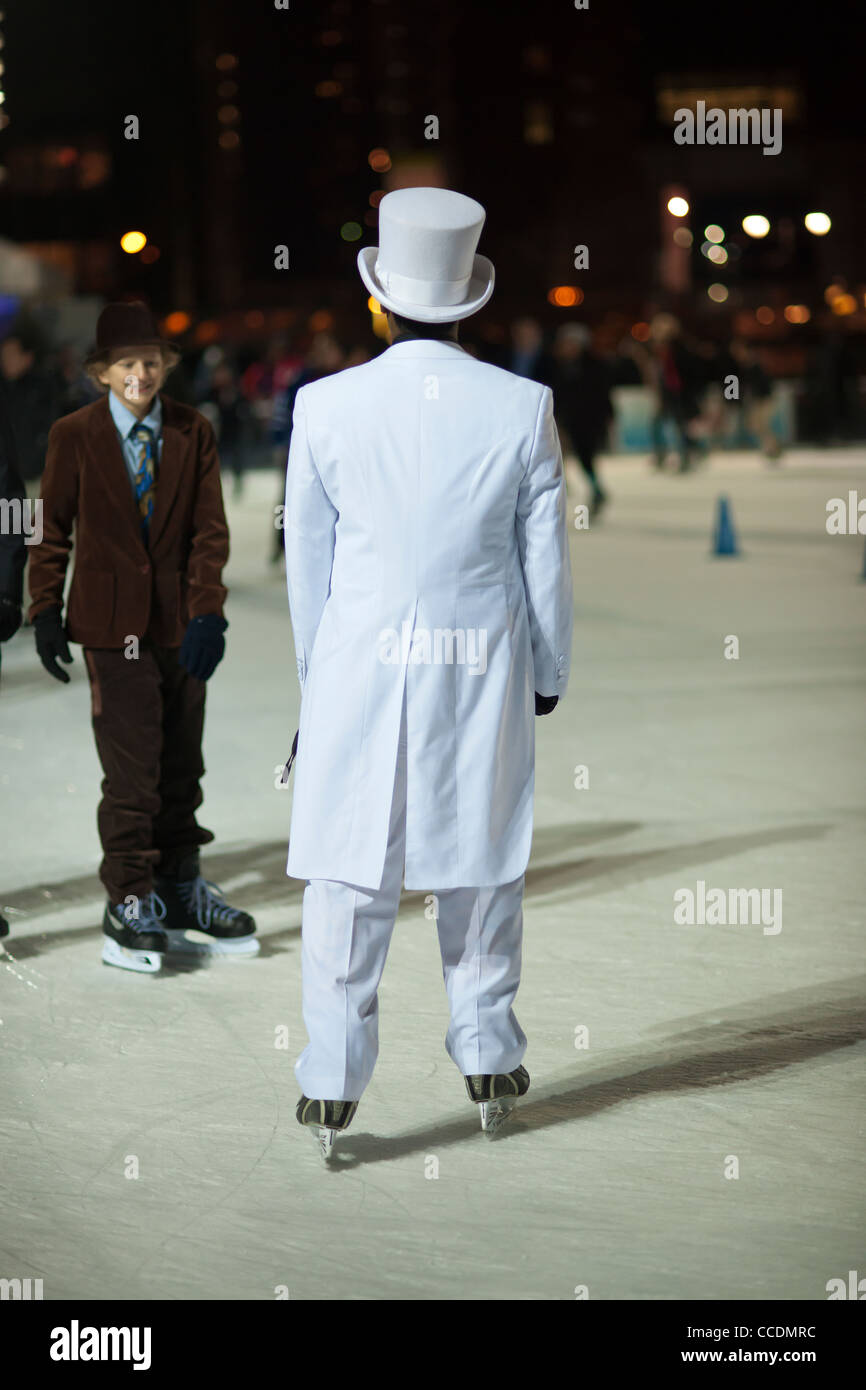 Skaters dressed in formal attire maneuver the packed Pond at Bryant