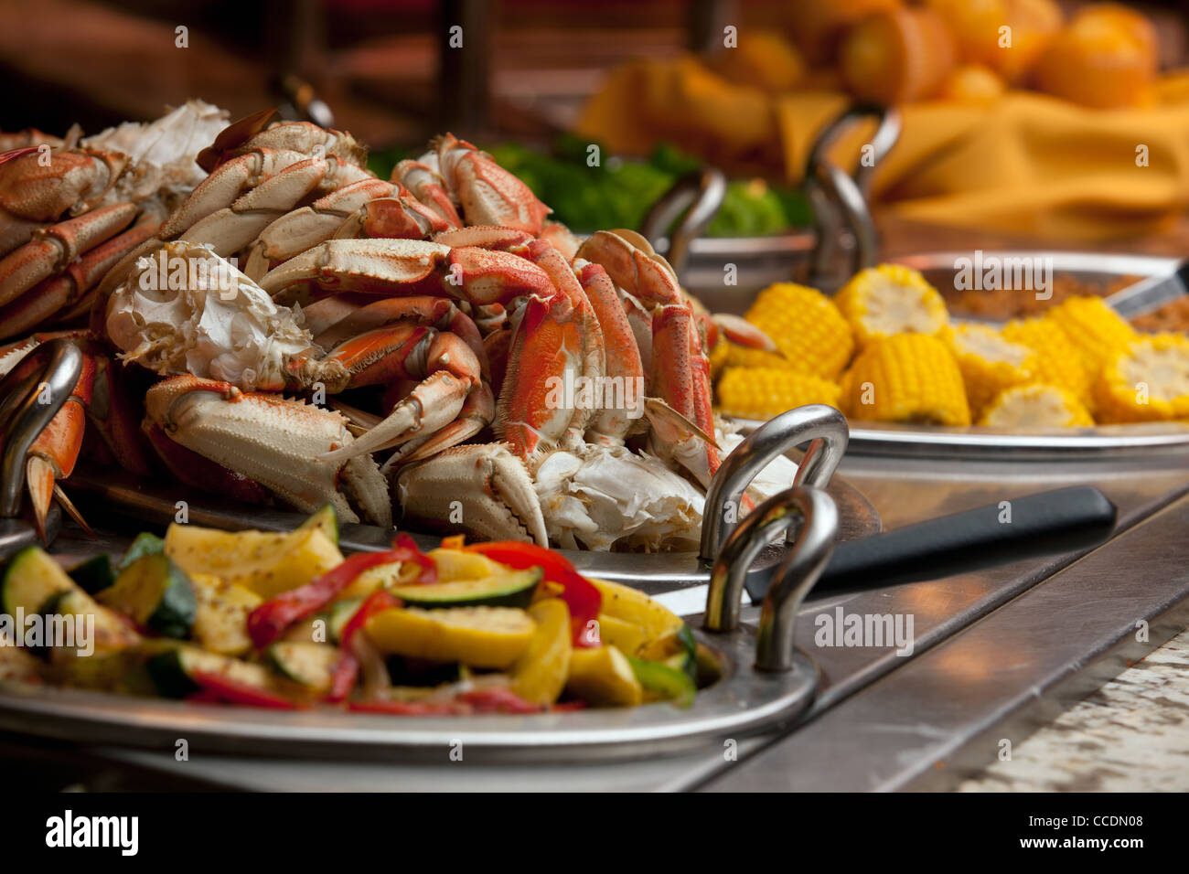 A classy buffet line at a resort's restaurant has crab legs as well as