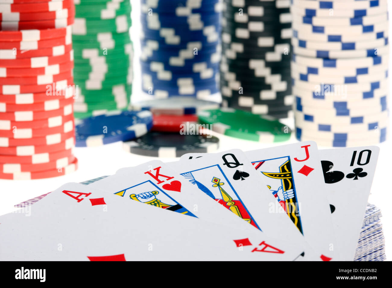 Poker game, different gaming tokes, chips, of different values. Playing cards. Stock Photo