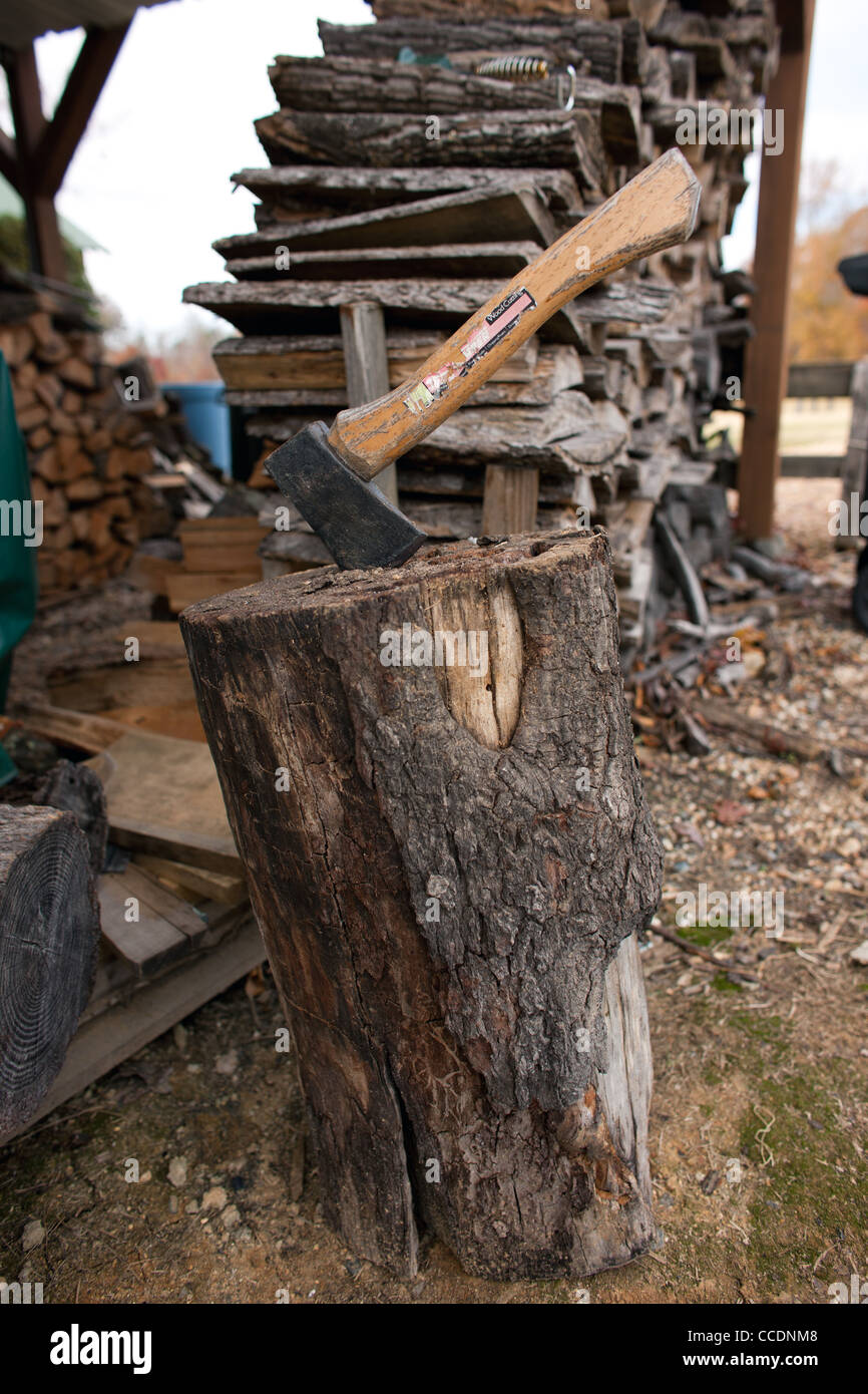 An ax is ready to chop more firewood at a home in North Carolina Stock Photo