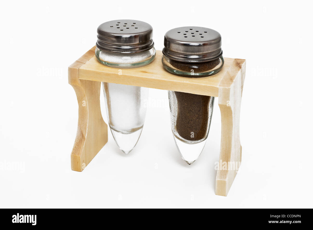 Detail photo of a rack, a salt and pepper shaker standing in it Stock