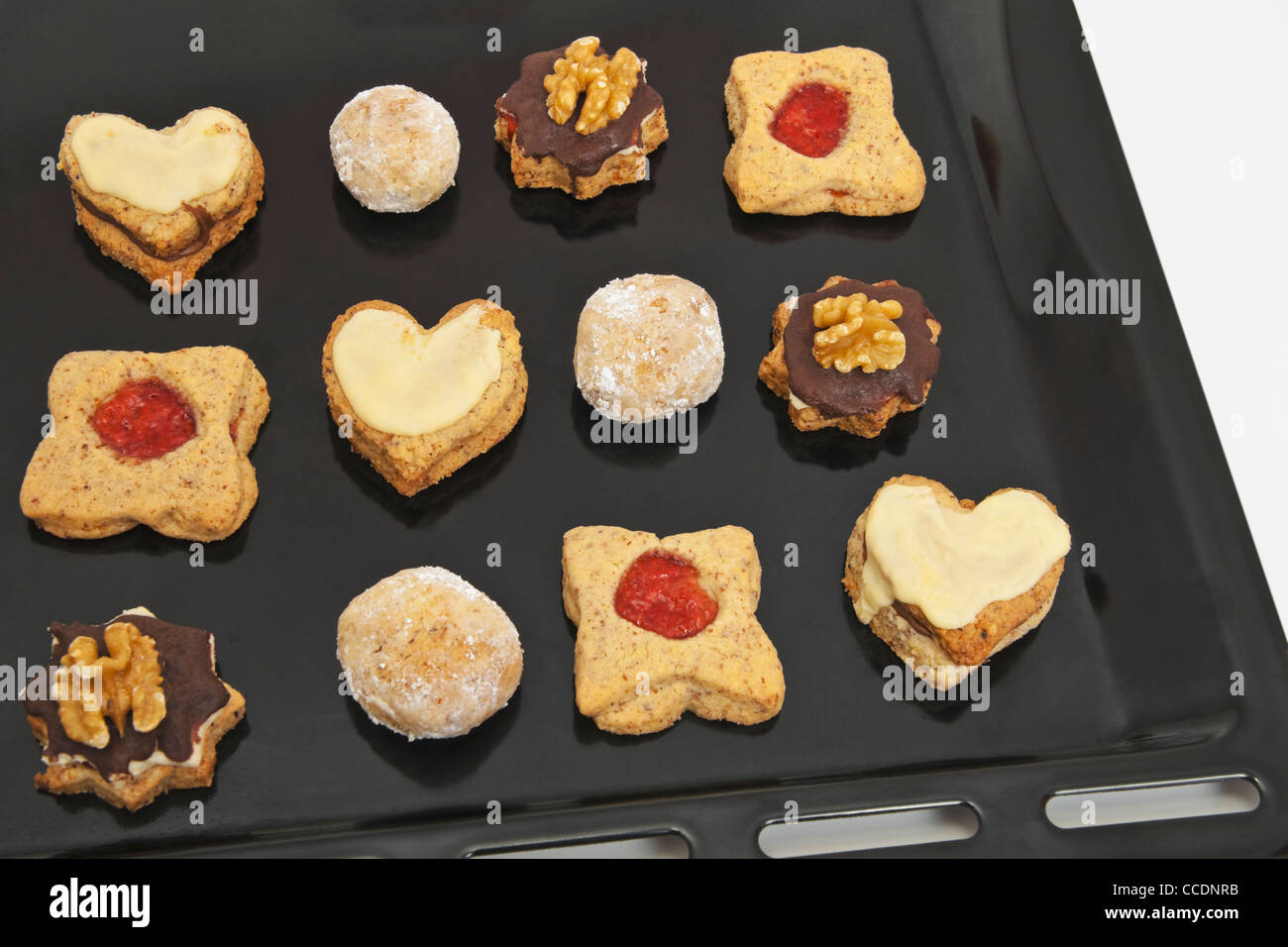 Detail photo of a baking tray with home-made Christmas biscuits Stock Photo