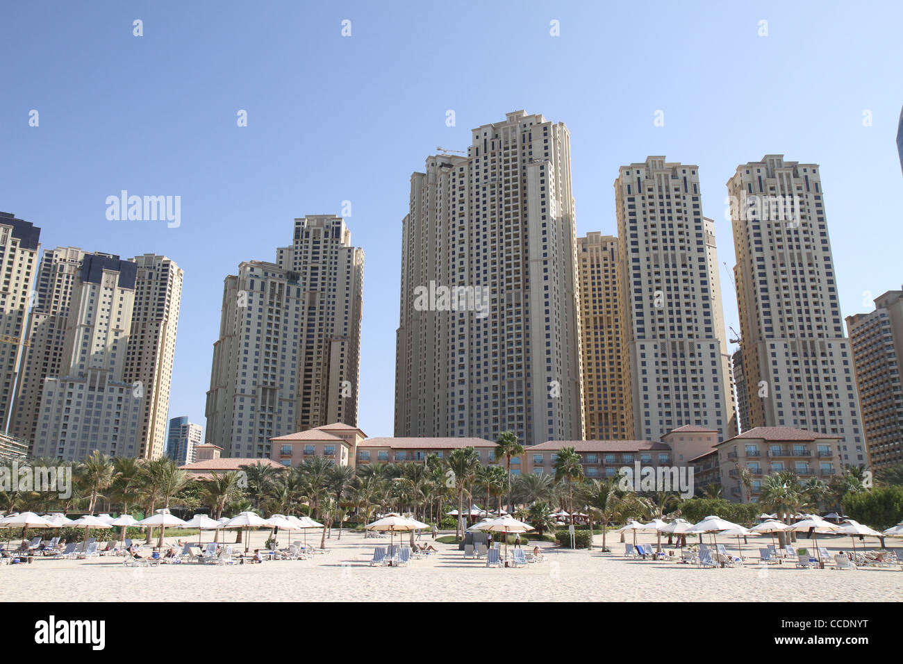 A view from the beach on the Dubai Marina with the Ritz Carlton Hotel at the forefront. Stock Photo