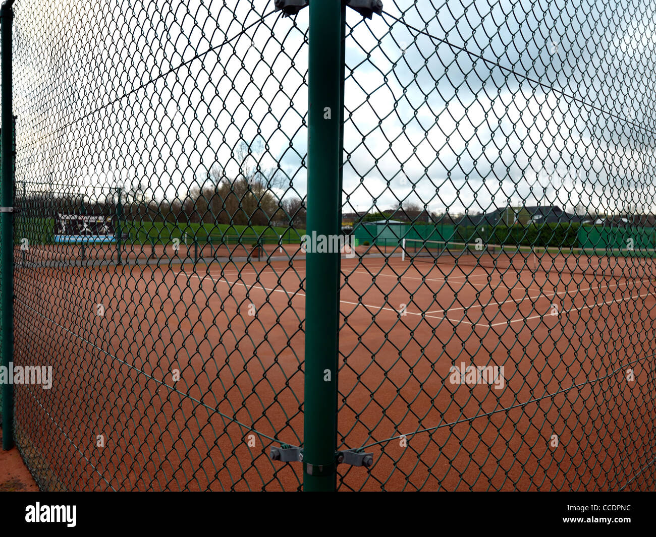 Wire Mesh Fencing Around Tennis Courts Stock Photo