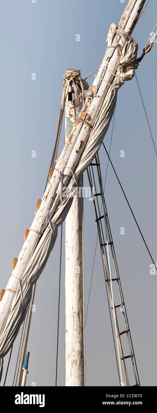 Vertical shot of dahabiya mast, rigging and canvas sail, on River Nile Luxor Egypt, Africa Stock Photo