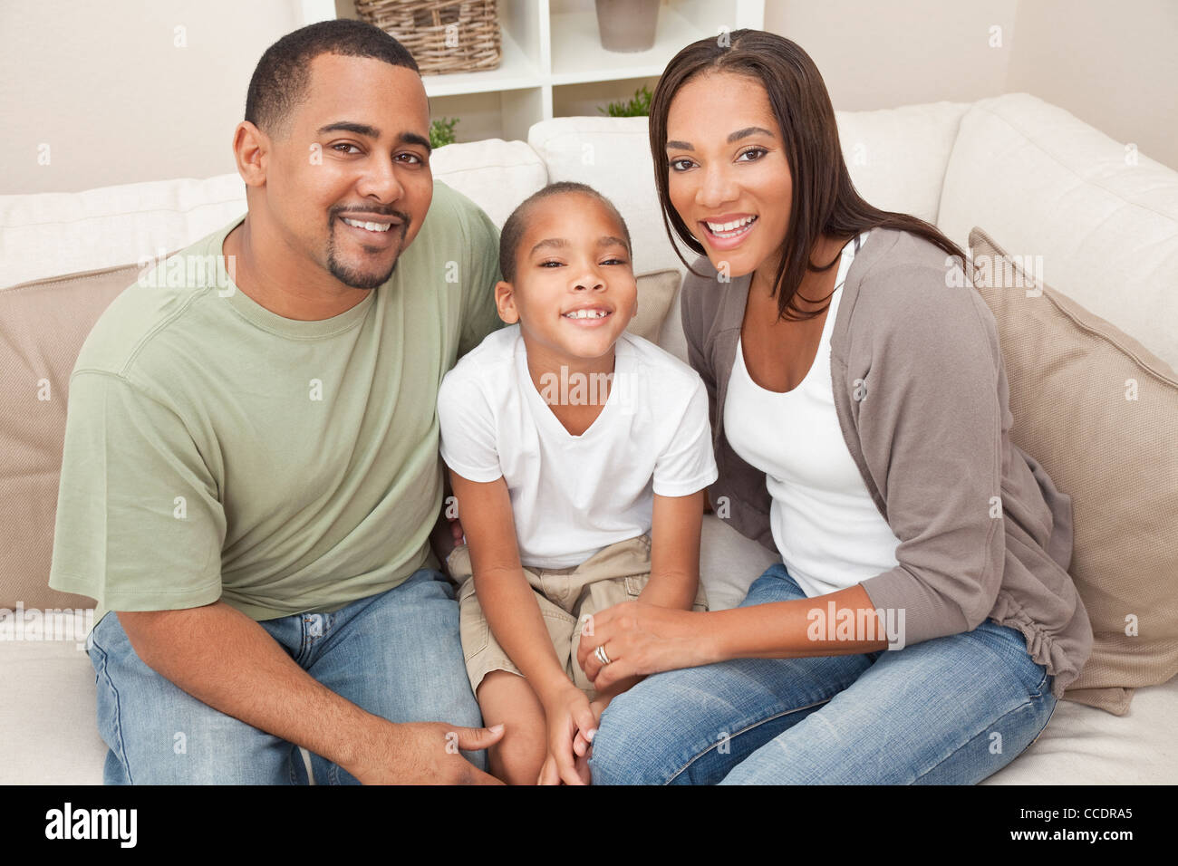 A happy African American man, woman and boy, father, mother and son ...