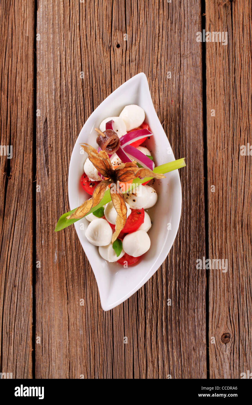 Bowl of mozzarella cheese, tomato and basil Stock Photo - Alamy