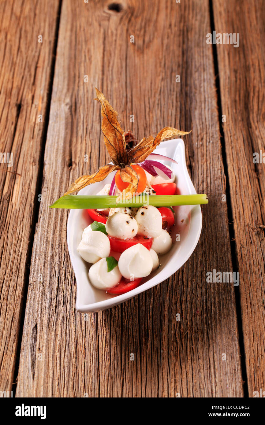 Bowl of mozzarella cheese, tomato and basil Stock Photo - Alamy