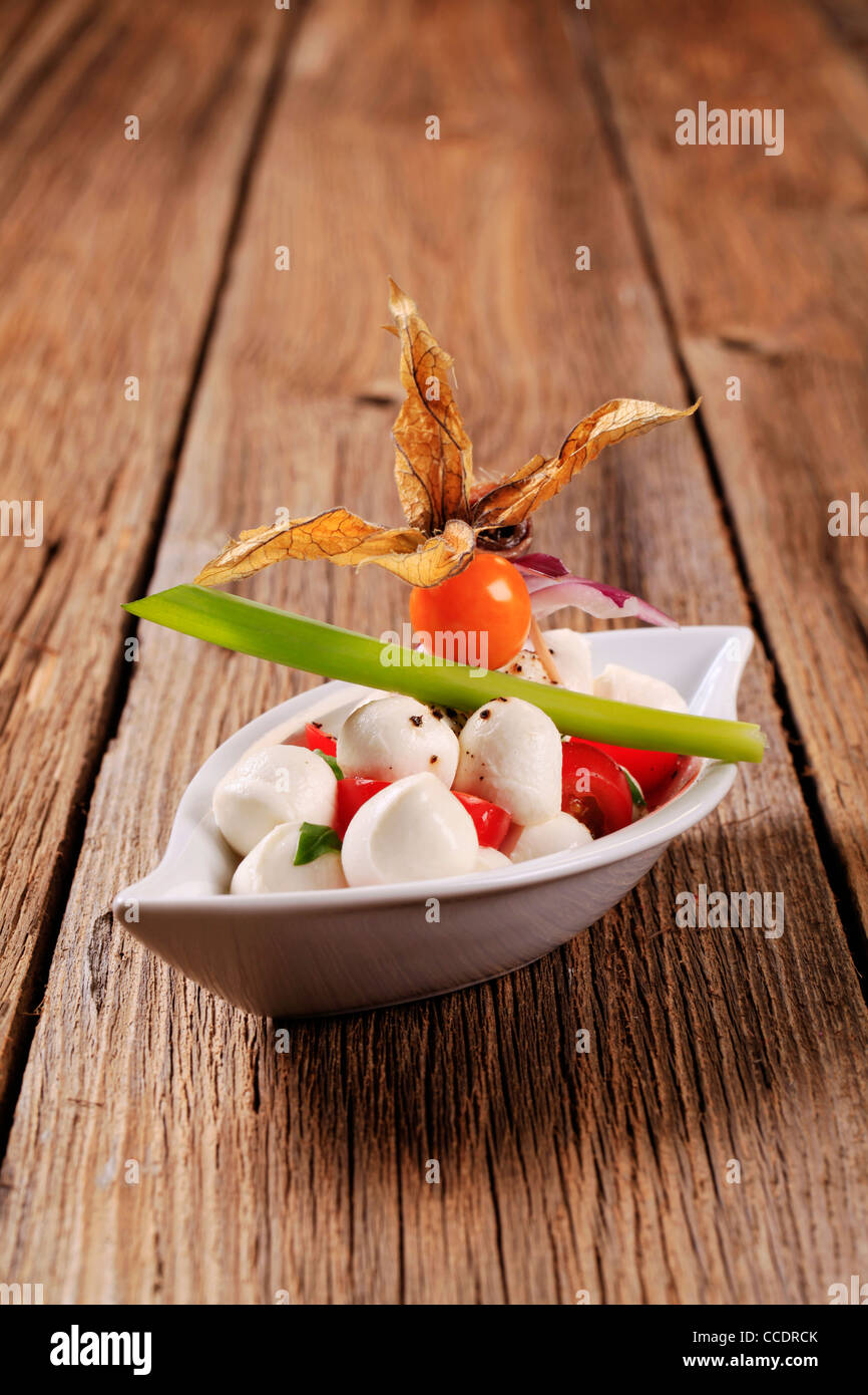 Bowl of mozzarella cheese, tomato and basil Stock Photo - Alamy