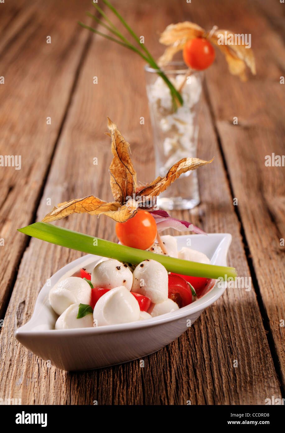 Bowl of mozzarella cheese, tomato and basil Stock Photo - Alamy