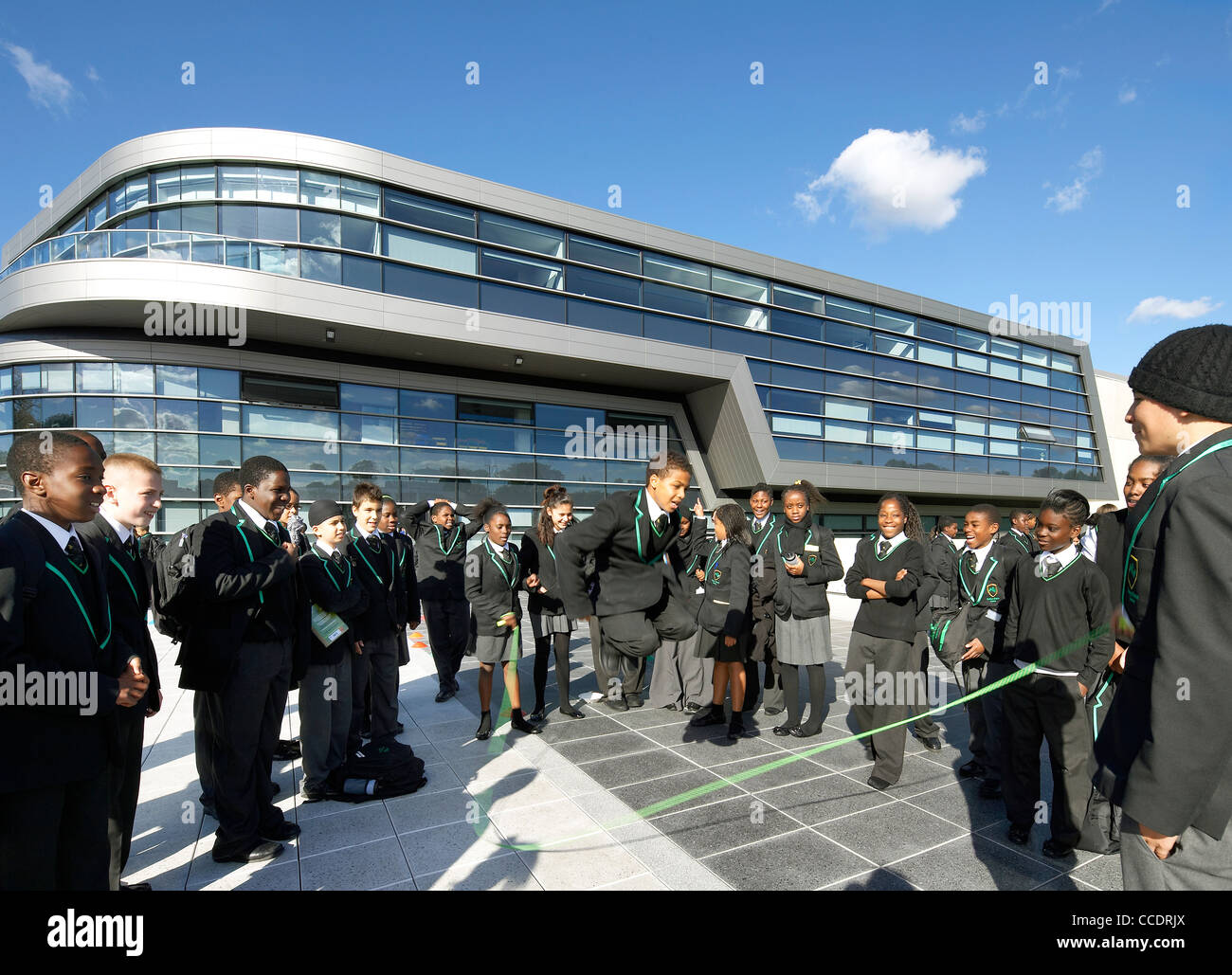 EVELYN GRACE ACADEMY, ZAHA HADID ARCHITECTS, LONDON, 2010, EXTERIOR WITH PUPILS SKIPPING Stock Photo