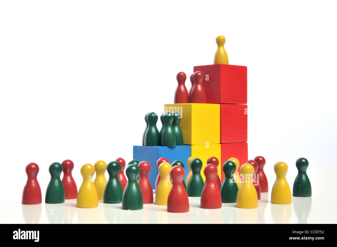 Hierarchy - Multicolored wooden toy blocks and figures on white background Stock Photo