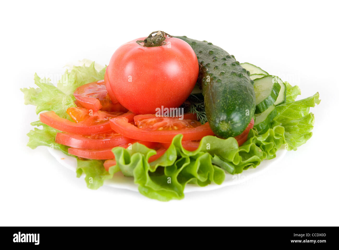 Healthy combination of lettuce, tomato and cucumber on white Stock