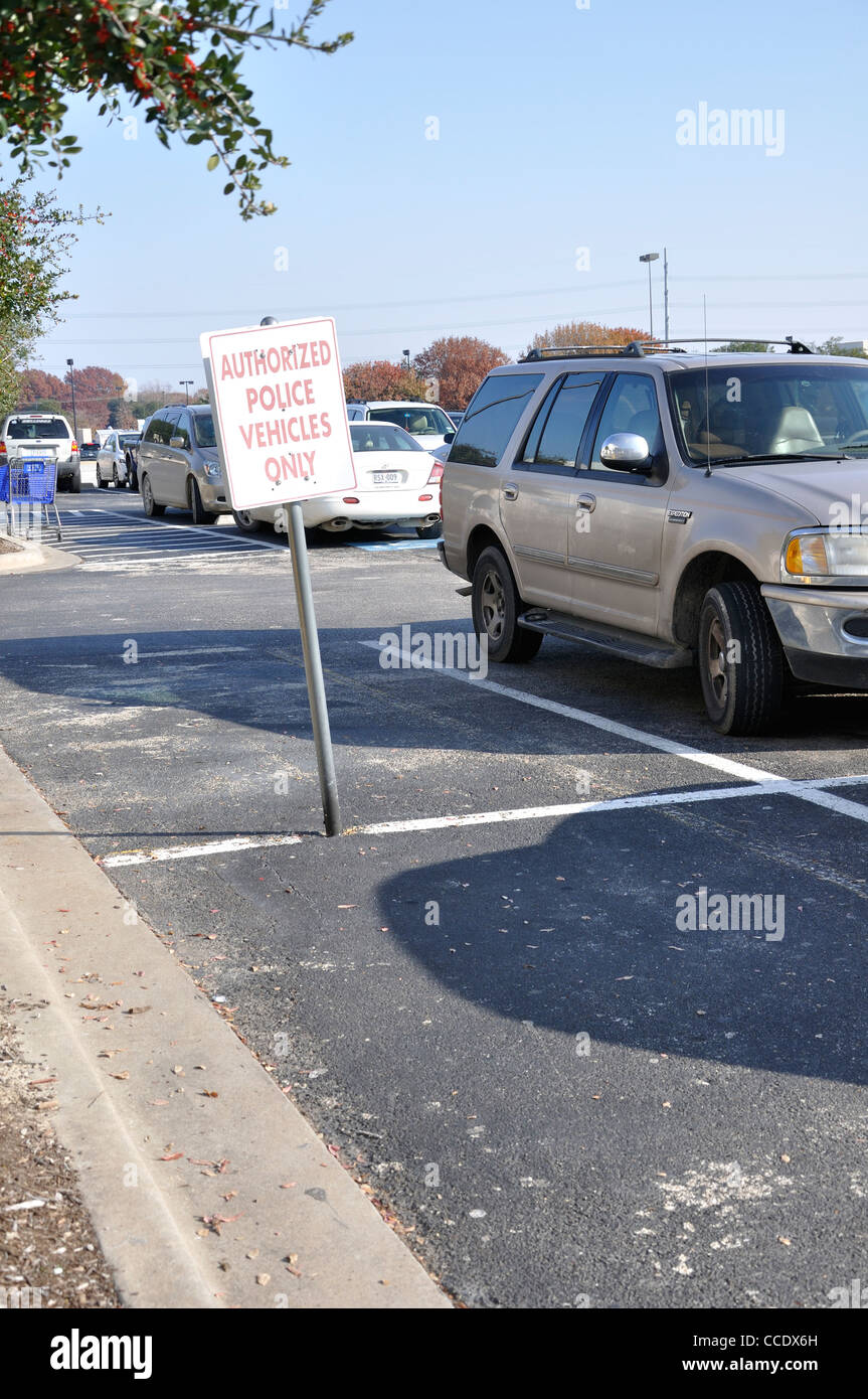 Authorized police vehicles only sign in parking lot, USA Stock Photo
