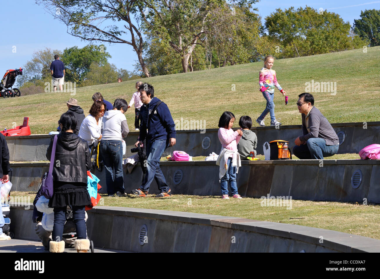 Dallas Arboretum, Texas, USA - Asian people in park Stock Photo