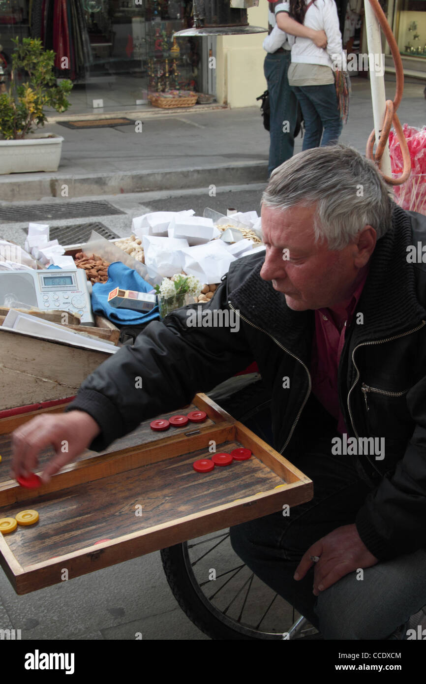 Men playing tavli (backgammon), traditional game in Greece, Monastiraki, Athens, Attica, Greece Stock Photo