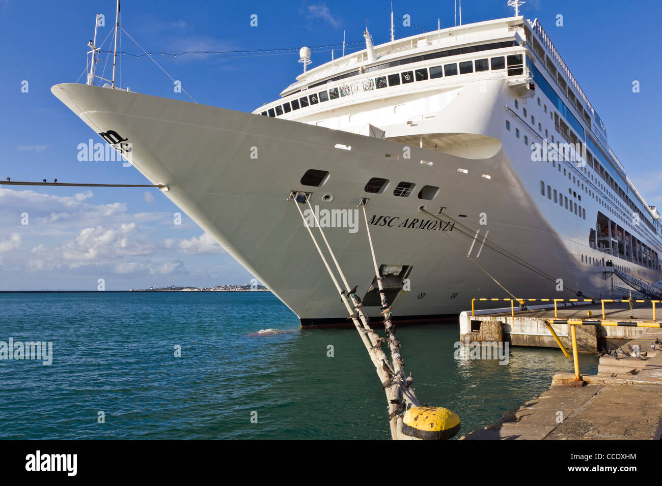 Detail of cruise ship MSC Armonia docked showing mooring lines or