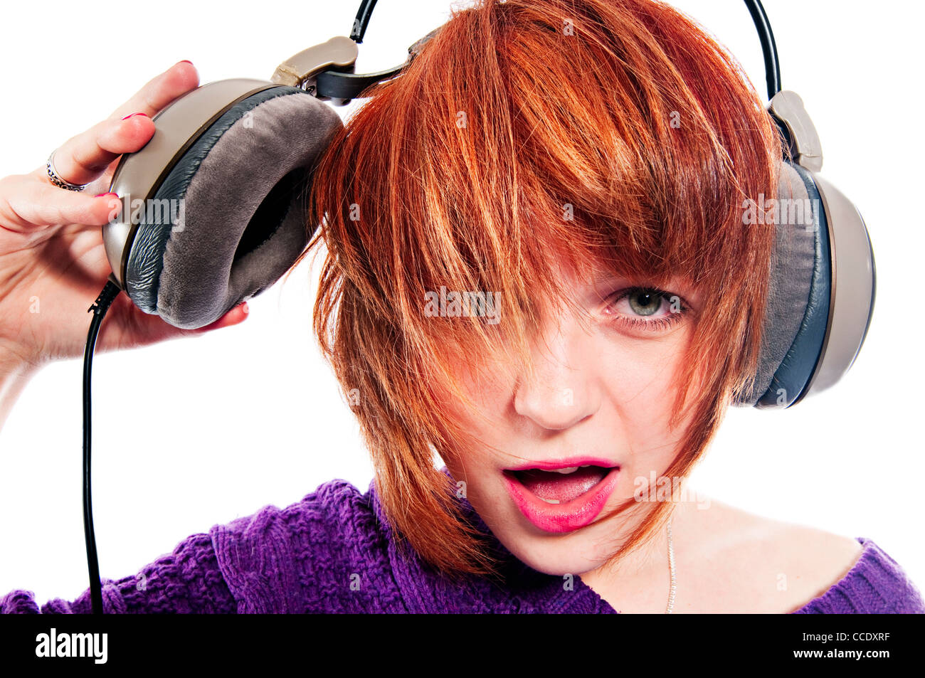Loud music girl with headphones isolated on white Stock Photo Alamy