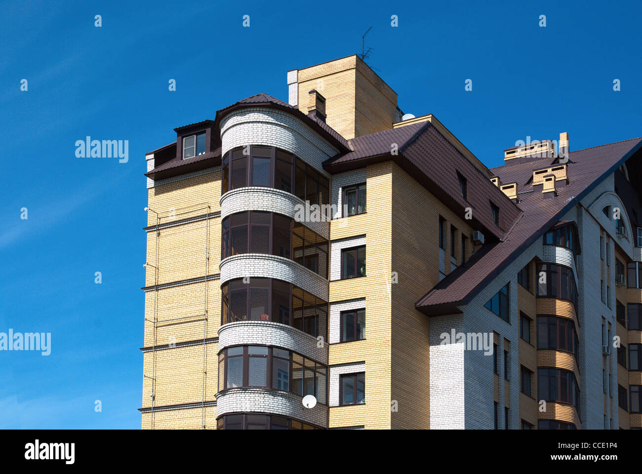 New apartment house on blue sky background Stock Photo - Alamy