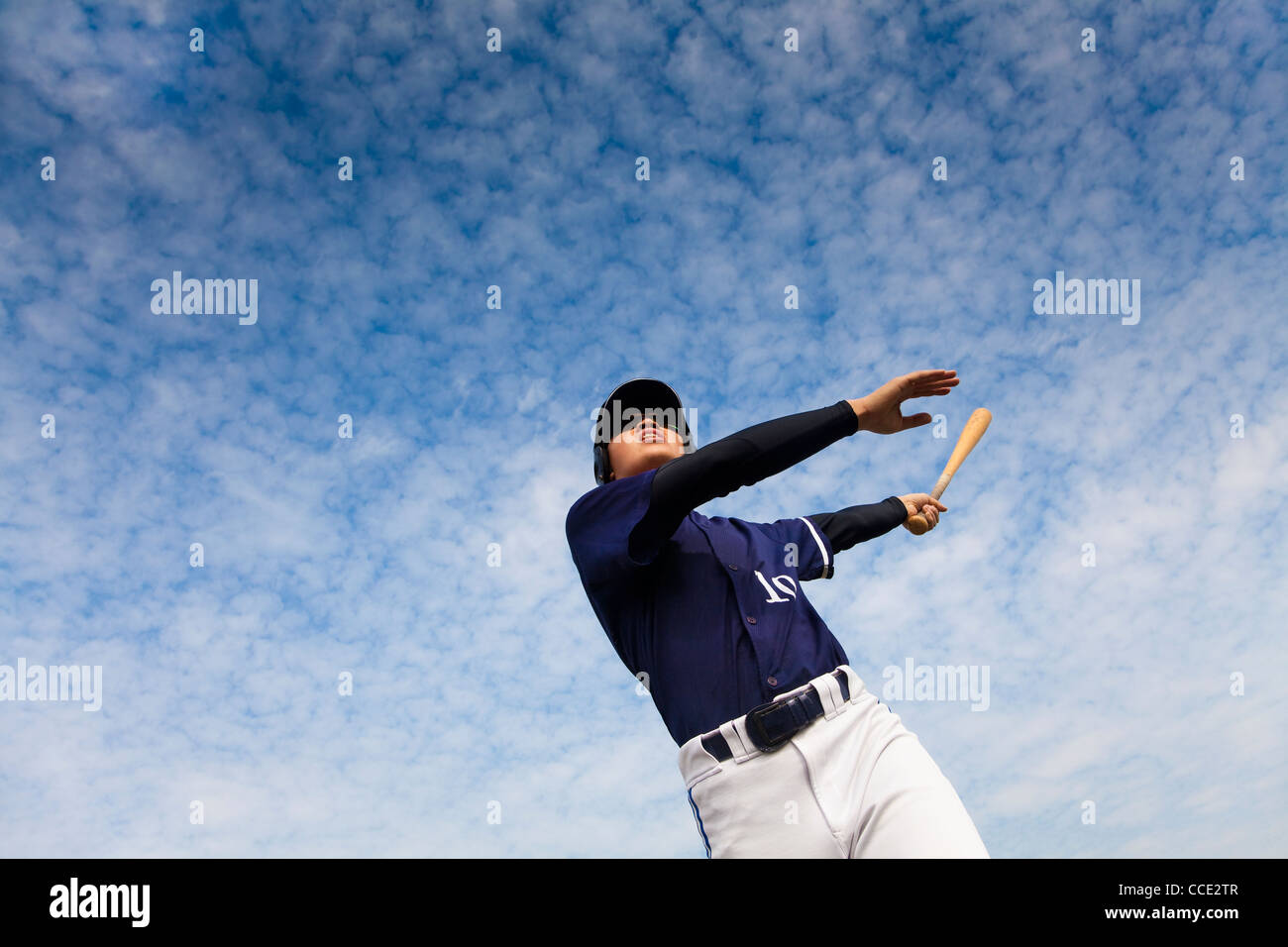 young baseball player taking a swing Stock Photo