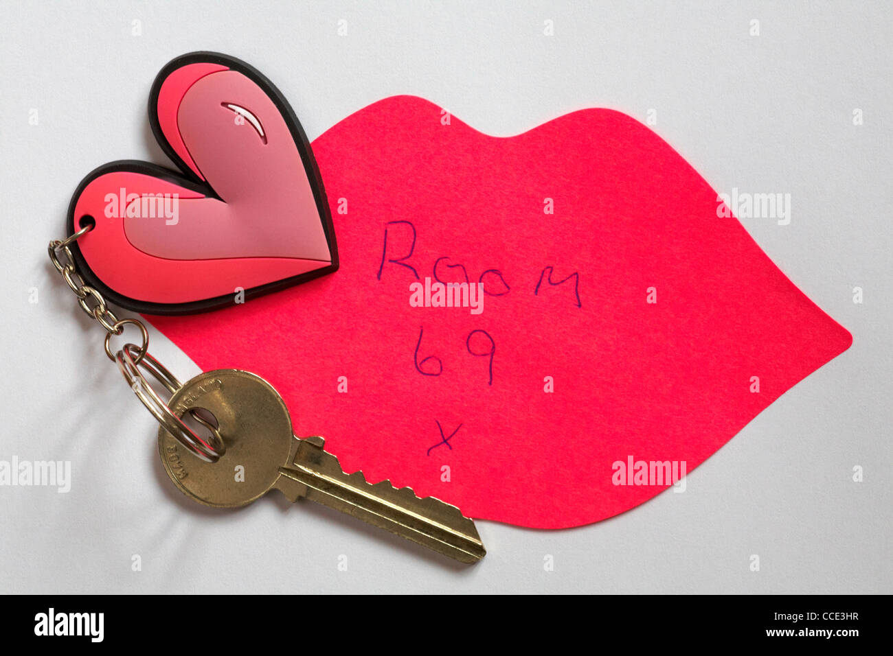 Post it note hand written message with key to room 69 on heart shaped