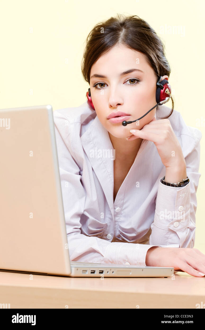 Pretty female operator near computer Stock Photo - Alamy