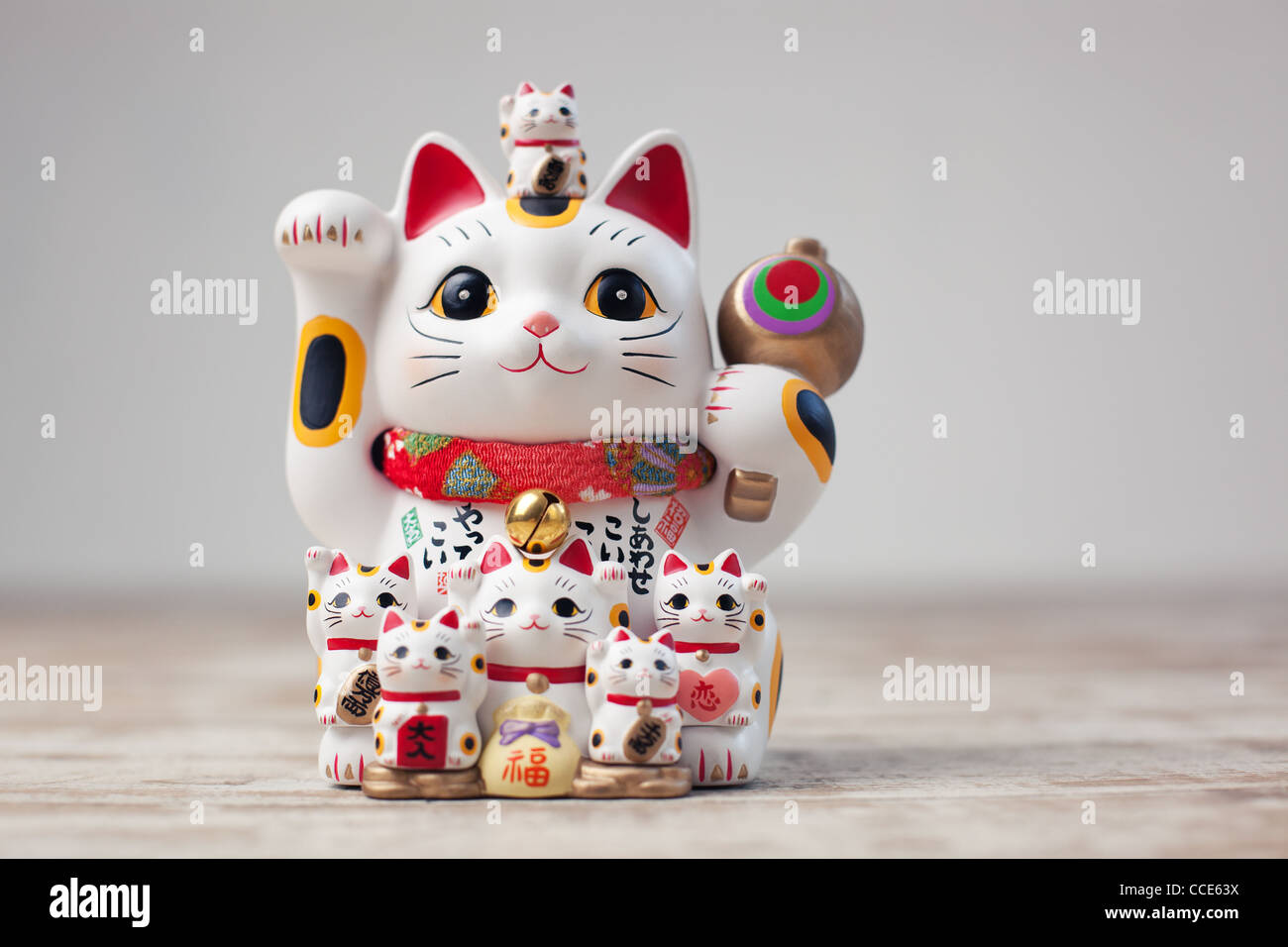 Maneki Neko cat. Common Japanese sculpture bring good luck to the owner. Stock Photo