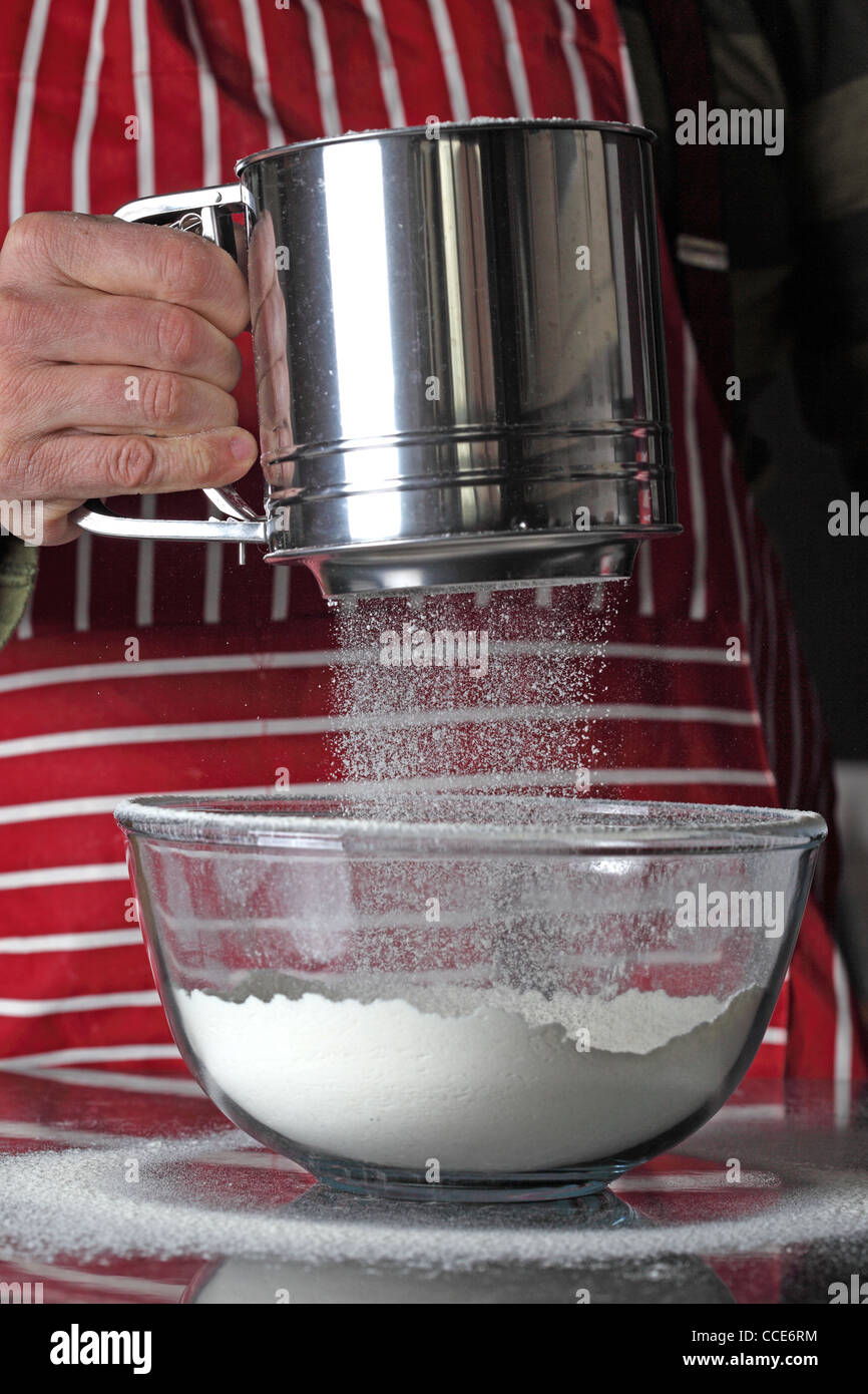 sifting flour Stock Photo