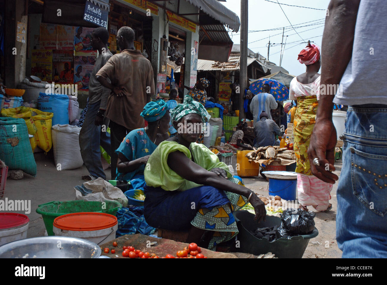 Senegalese women selling vegetables in the street, M'bour market, M'bour, Senegal. Stock Photo