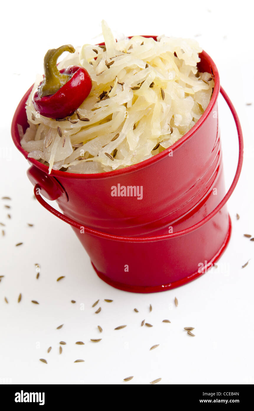 sauerkraut with caraway seeds in a red bucket Stock Photo