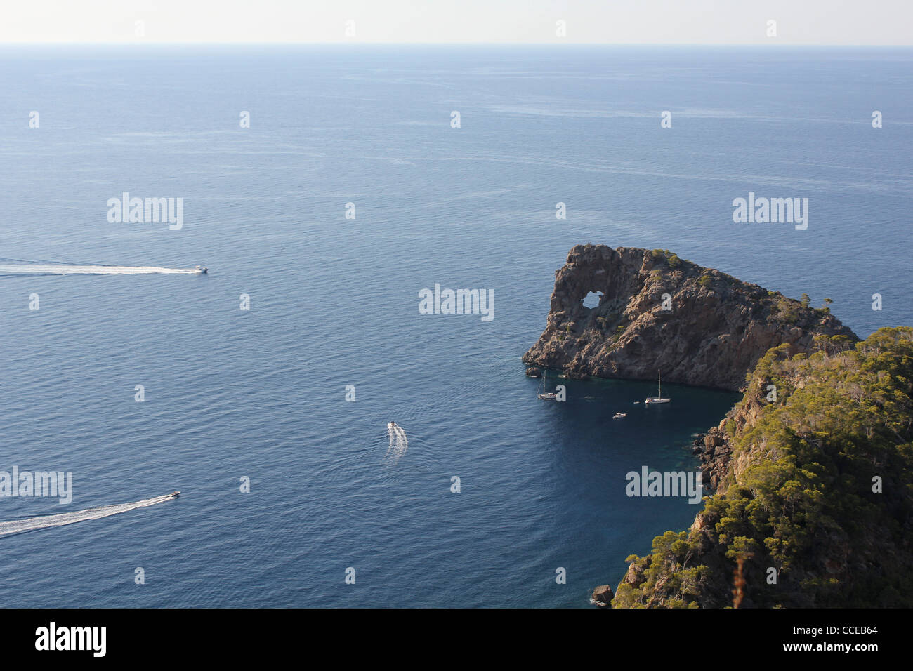 Coastal scene with yachts at Peninsula de Sa Foradada, near Deya / Deia, West Coast Mallorca / Majorca, Balearic islands, Spain Stock Photo