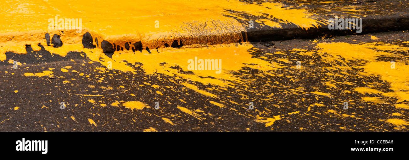 Yellow ochre paint spill, Hoi An, Vietnam Stock Photo