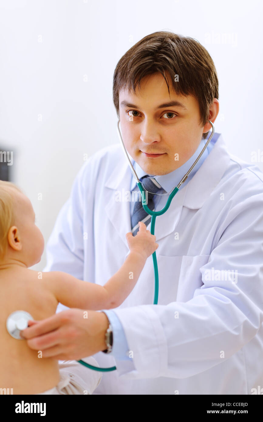Pediatric doctor checking baby using a stethoscope Stock Photo Alamy
