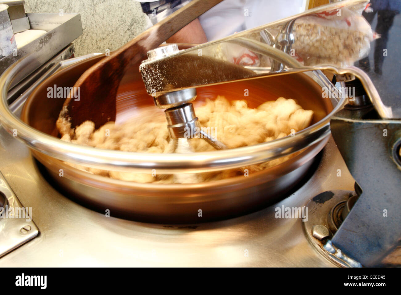 close up of rotating roasting machine with almonds at german mobile sales booth at fair, germany, europe Stock Photo
