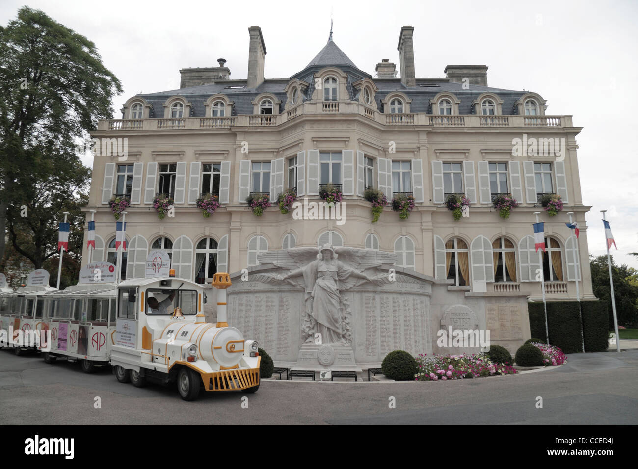 Tourist train in front of the Hotel de Ville (town hall), Épernay, Champagne-Ardenne, Marne, France. Stock Photo