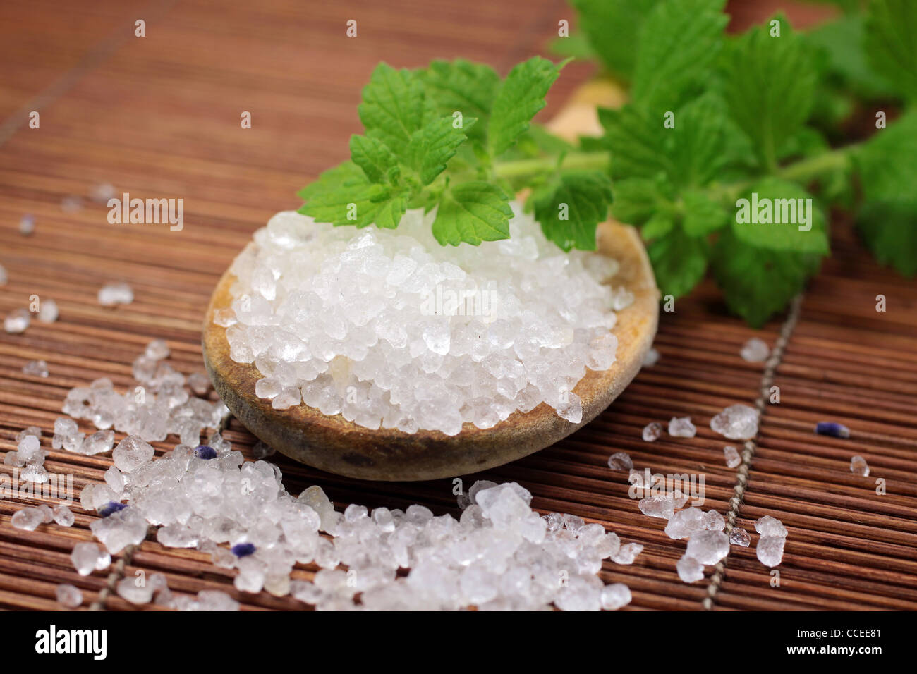 wooden spoon with bath salt and herbs Stock Photo