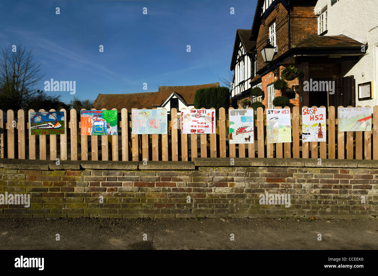 A row of children's paintings depicting protest against the Chiltern high speed rail link Wendover Bucks UK Stock Photo