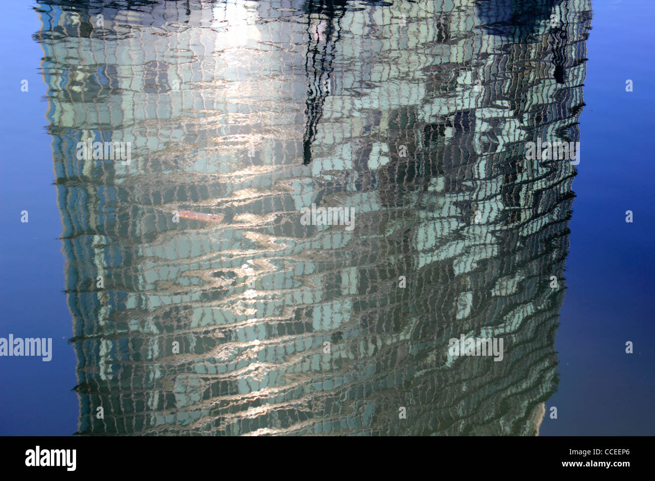 Reflection of 1 West India Quay a tower block in Docklands houses the Marriott Hotel and luxury apartments. London England UK Stock Photo