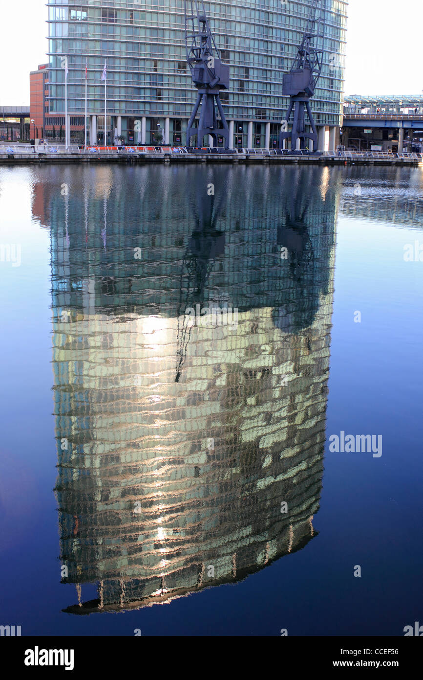 Reflection of 1 West India Quay a tower block in Docklands houses the Marriott Hotel and luxury apartments. London England UK Stock Photo