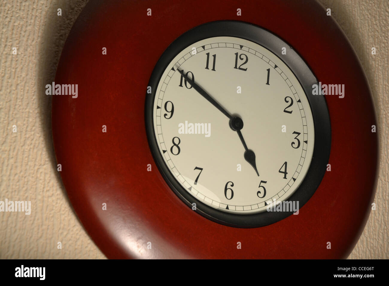 Retro clock hanging on wall. It's almost quitting time Stock Photo Alamy