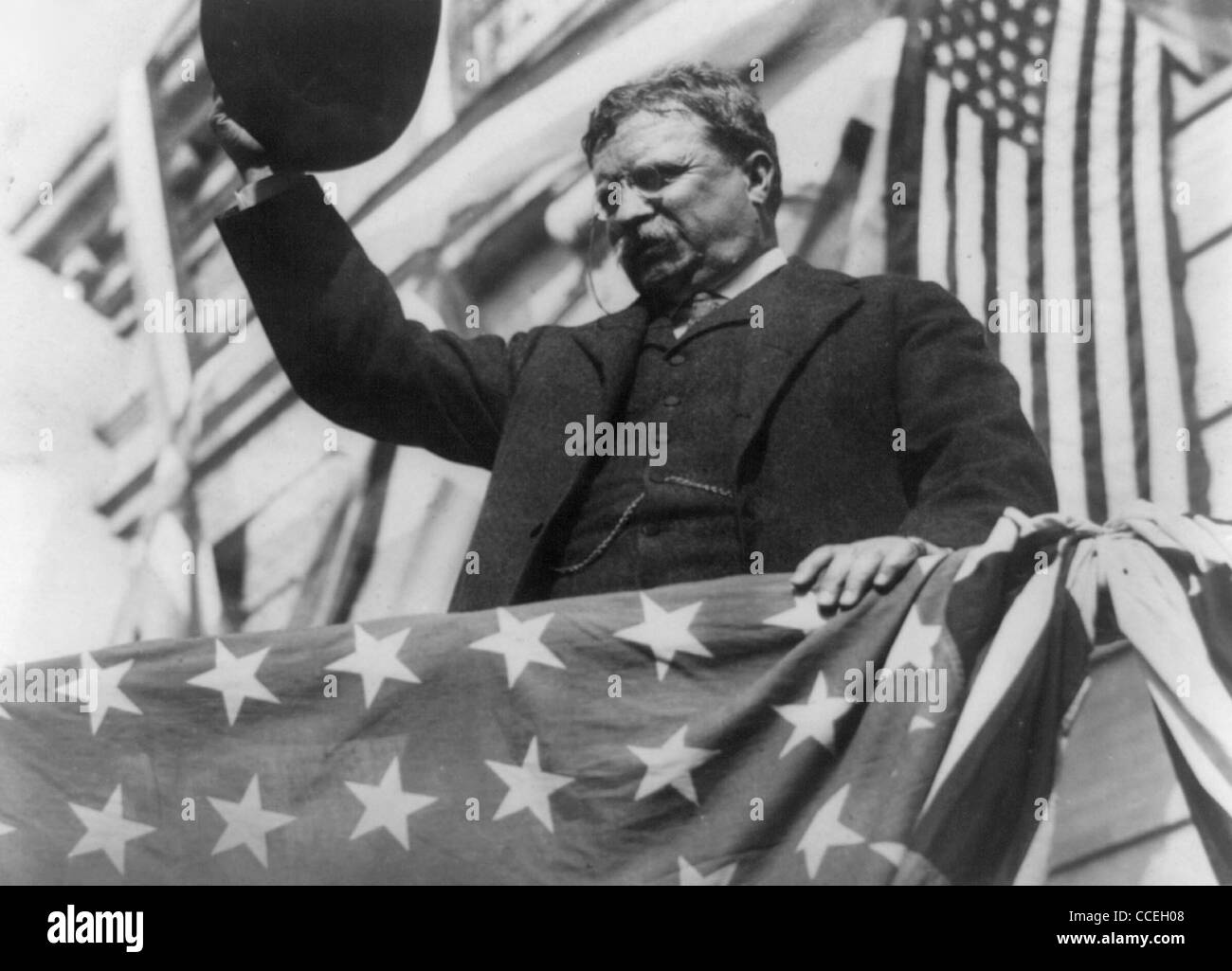 President Theodore Roosevelt making speech with American flag Stock Photo