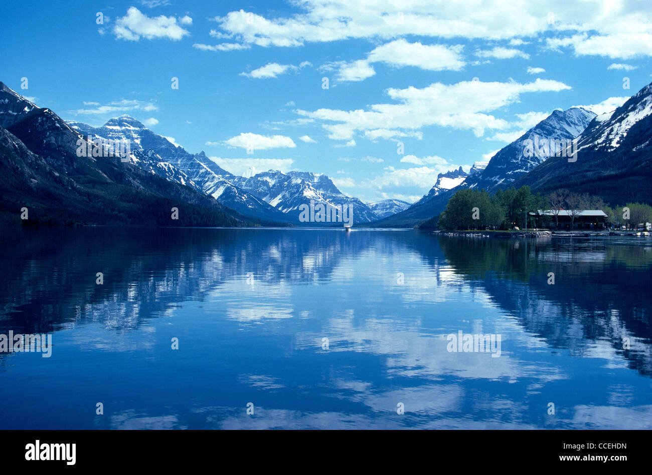 The Canadian Rocky Mountains surround peaceful lakes in Waterton Lakes National Park in Alberta, Canada. Stock Photo