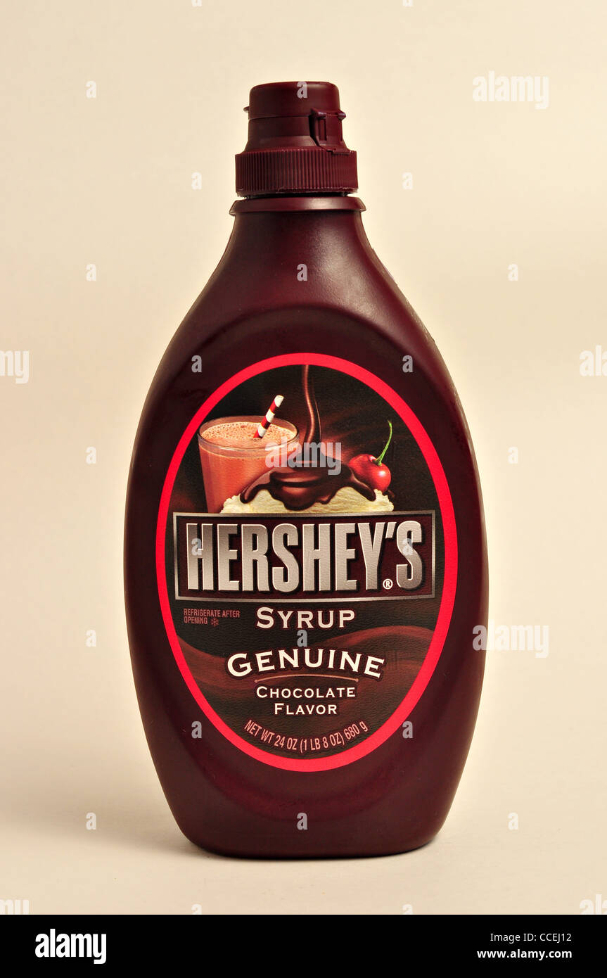 Container of Hershey's Chocolate Flavor Syrup on a plain white background. Stock Photo
