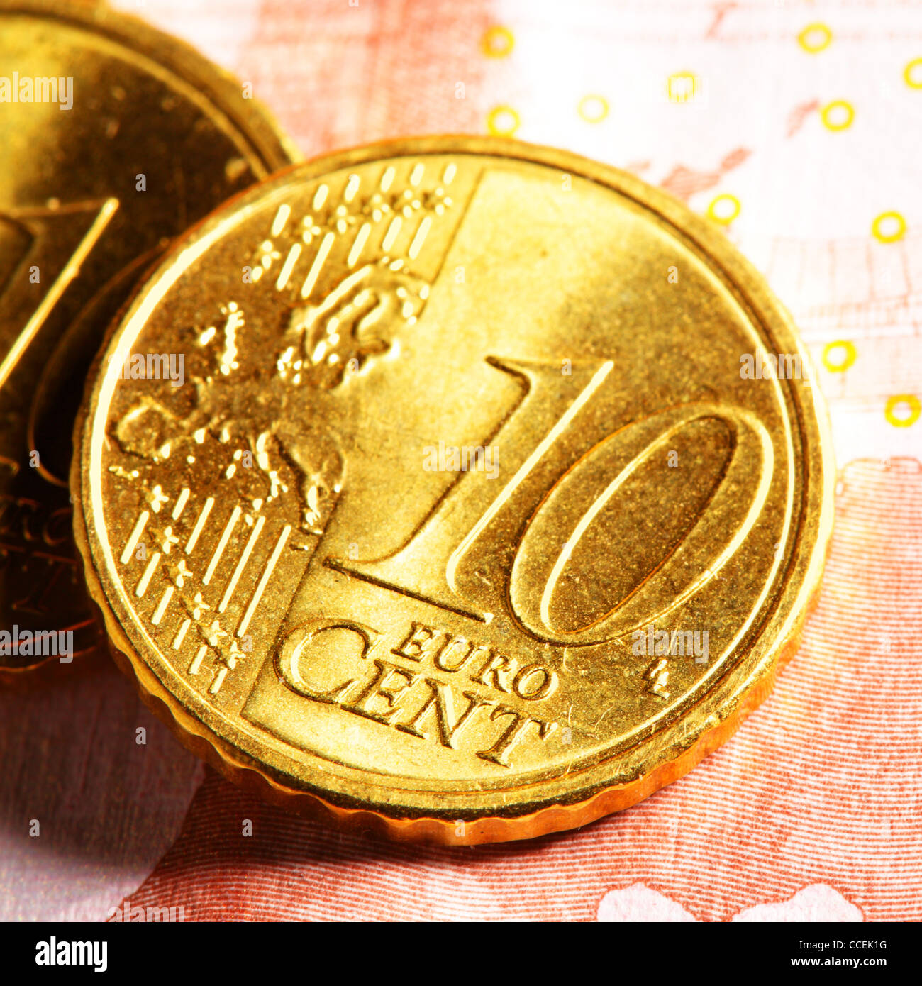 Ten euro cent coins close up on bank note Stock Photo