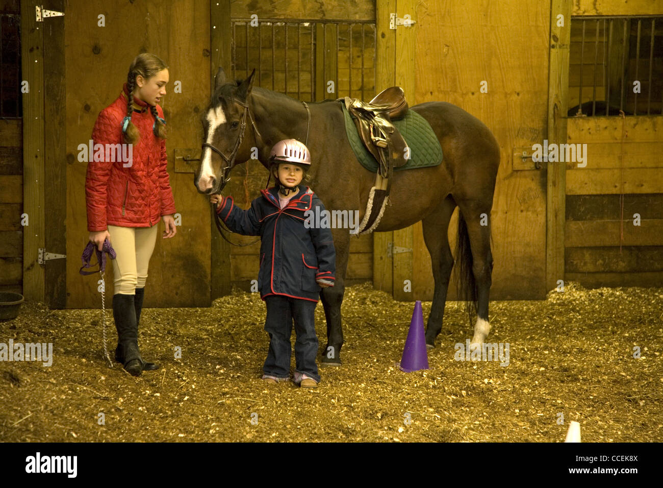 Five year old girl at a horseback riding lesson in Brooklyn, New York