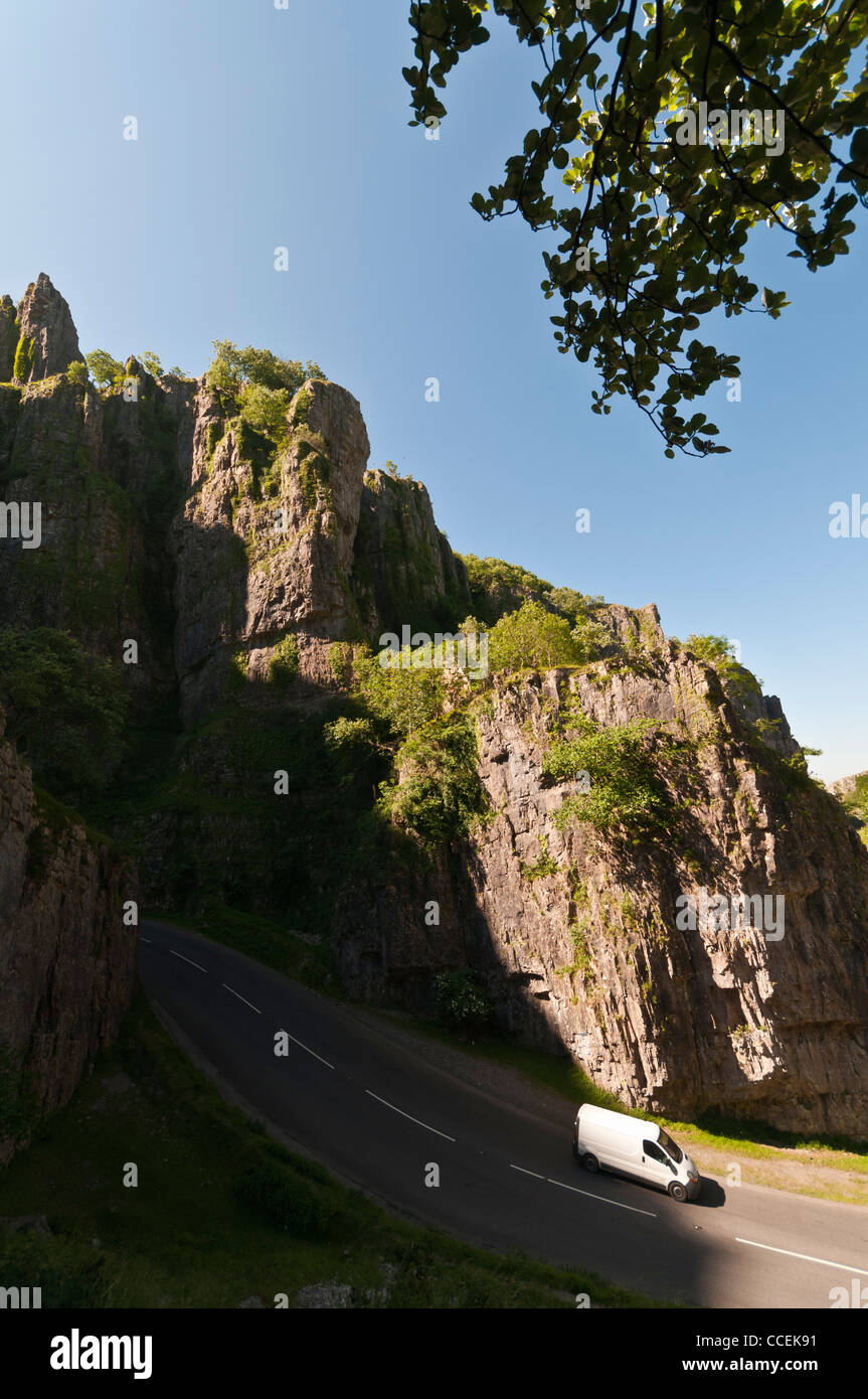 A white van driving though Cheddar Gorge In Somerset on a sunny day Stock Photo