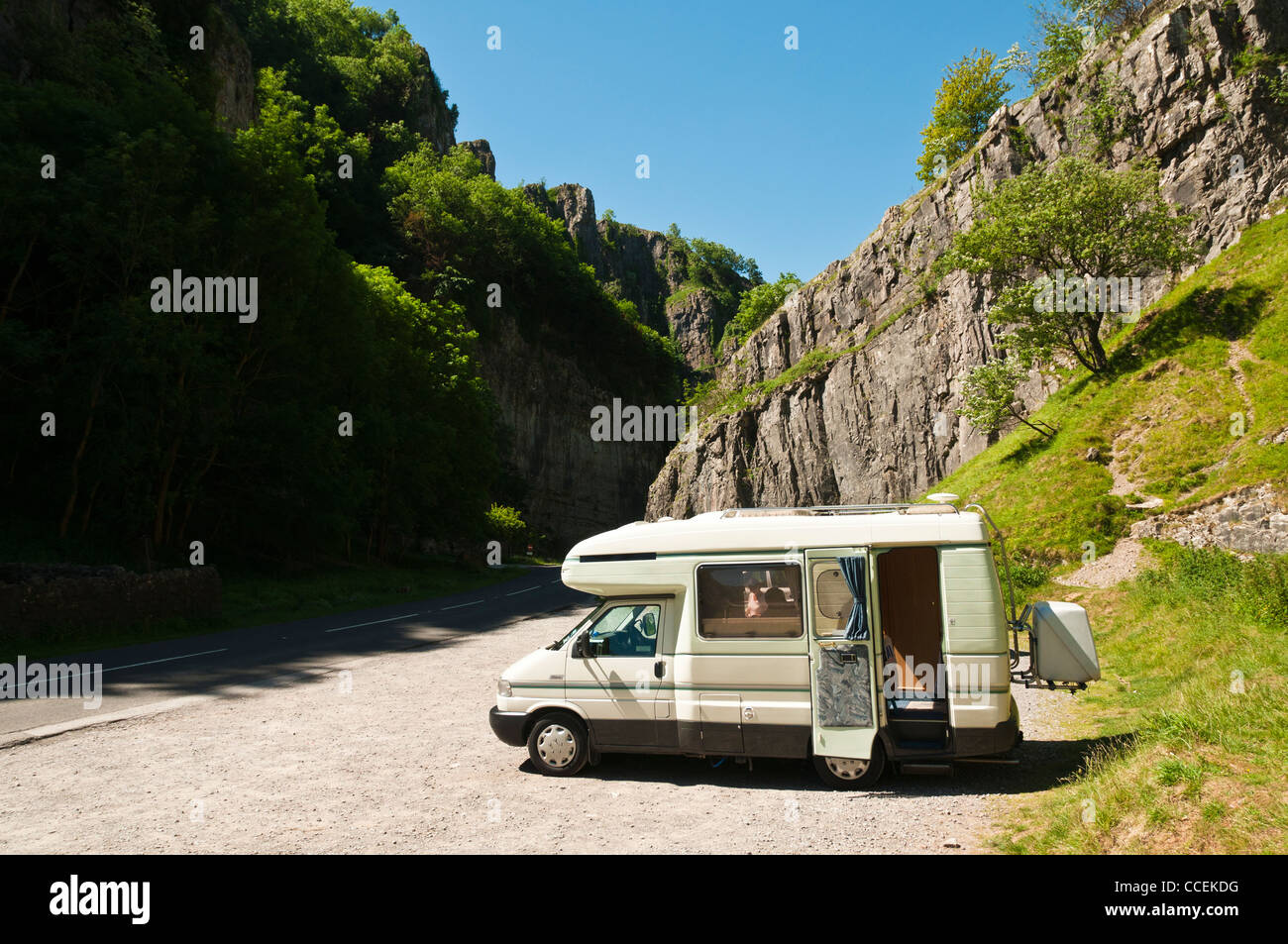 A motorhome parked in the world famous Cheddar Gorge in Somerset on a very sunny summer day. Stock Photo